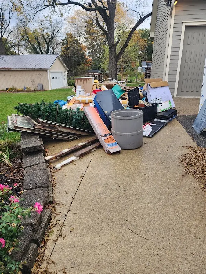 Dumpster being loaded with debris for 3 Yard Dumpster Rental in Lake Darby
